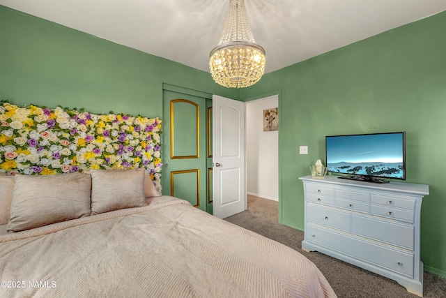 bedroom featuring carpet flooring and a chandelier