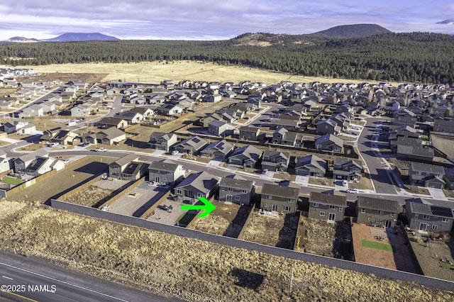 11941 Pegasus Rd, Bellemont, AZ 86015 - aerial view of property and surrounding area featuring a mountain backdrop and nearby suburban area
