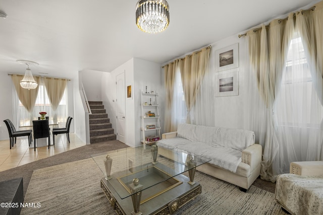 tiled living room with an inviting chandelier