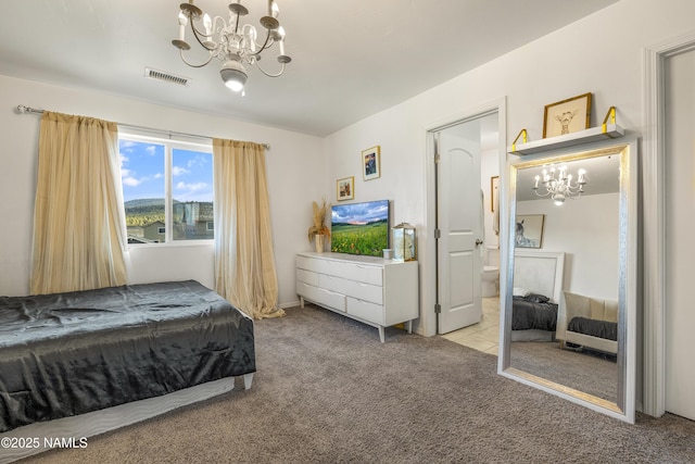 bedroom featuring light carpet, connected bathroom, and a chandelier