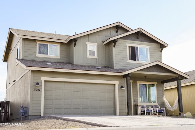 11941 Pegasus Rd, Bellemont, AZ 86015 - view of front of home with an attached garage, driveway, and board and batten siding