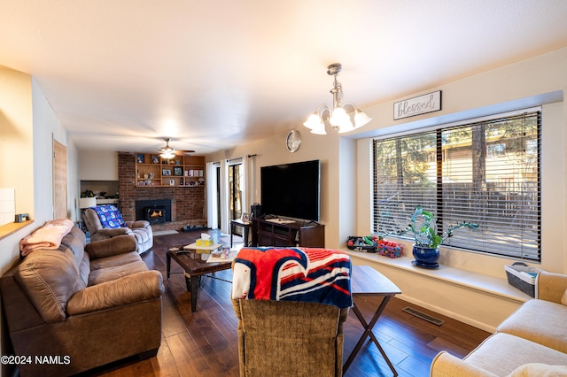 living room with plenty of natural light, visible vents, and hardwood / wood-style floors