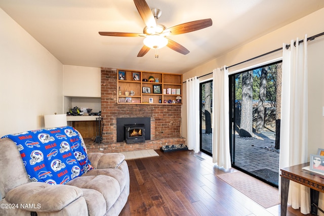 living area featuring hardwood / wood-style flooring and a ceiling fan