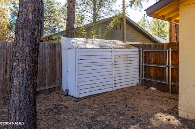 view of shed featuring a fenced backyard