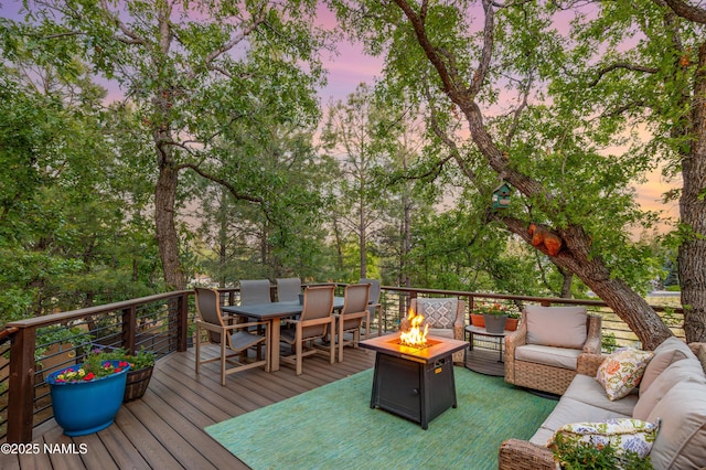 706 N Hulet Ln, Flagstaff, AZ 86004 - wooden terrace with an outdoor living space with a fire pit and outdoor dining area