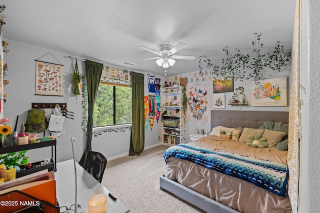 706 N Hulet Ln, Flagstaff, AZ 86004 - bedroom featuring carpet flooring, baseboards, a textured ceiling, and ceiling fan