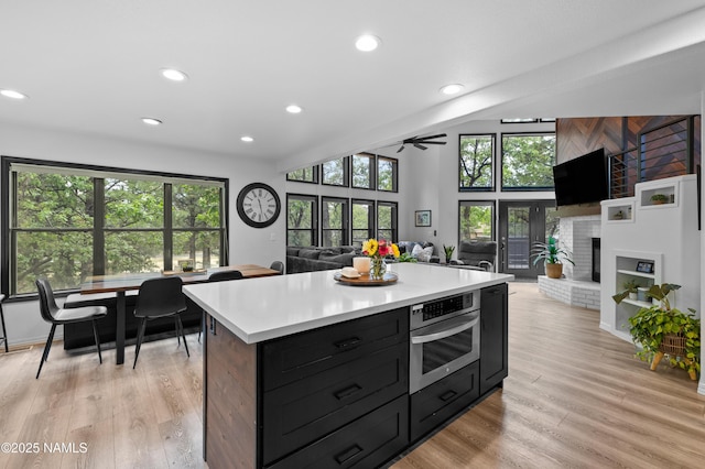 706 N Hulet Ln, Flagstaff, AZ 86004 - kitchen with oven, light countertops, recessed lighting, plenty of natural light, and open floor plan