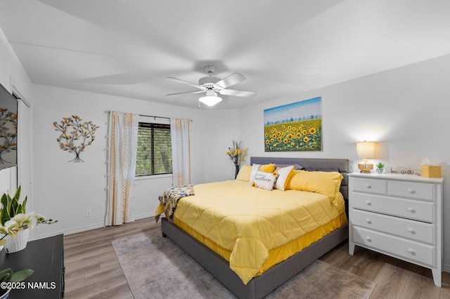 706 N Hulet Ln, Flagstaff, AZ 86004 - bedroom featuring wood finished floors, a ceiling fan, and baseboards