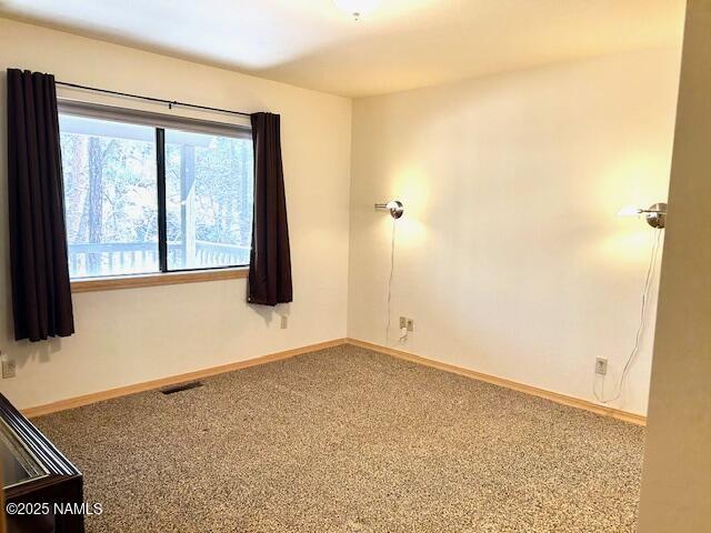 39 E Oak Dr, Munds Park, AZ 86017 - carpeted empty room featuring baseboards and visible vents