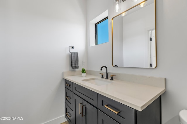 302 W Oak Ave Unit 1, Flagstaff, AZ 86001 - bathroom featuring vanity, toilet, and baseboards