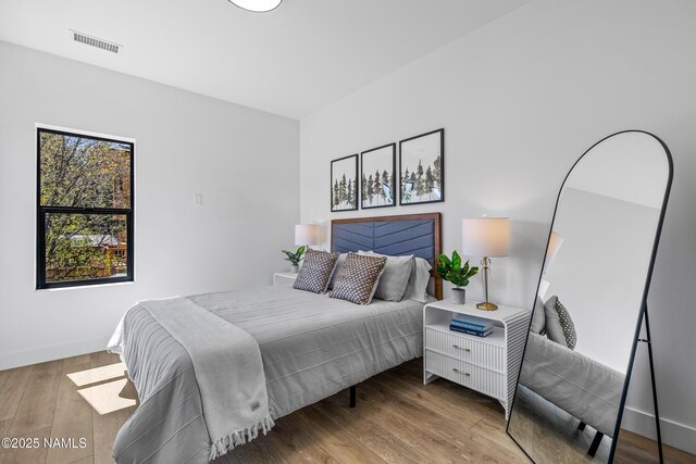302 W Oak Ave Unit 1, Flagstaff, AZ 86001 - bedroom featuring wood finished floors and baseboards