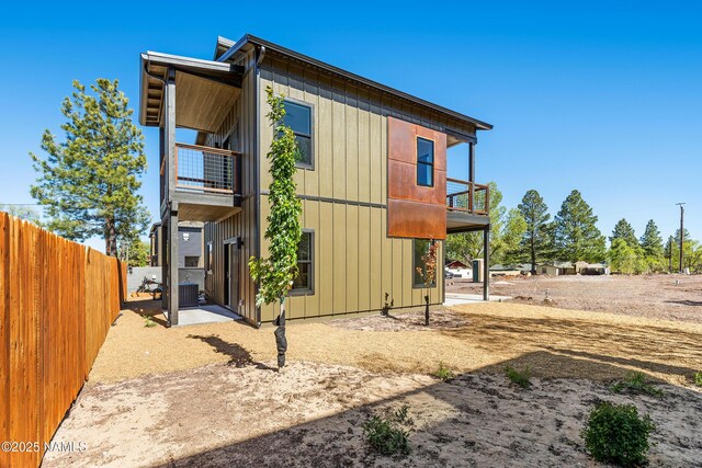 302 W Oak Ave Unit 1, Flagstaff, AZ 86001 - view of property exterior with a balcony, central air condition unit, and a patio area