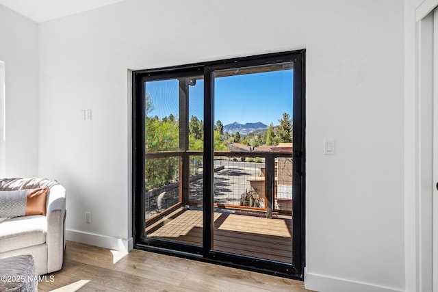 302 W Oak Ave Unit 1, Flagstaff, AZ 86001 - entryway featuring a mountain view, baseboards, and wood finished floors