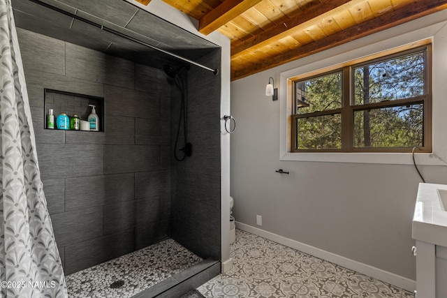 5552 White Tail Ln, Flagstaff, AZ 86005 - full bathroom with a tile shower, beam ceiling, tile patterned flooring, baseboards, and wooden ceiling