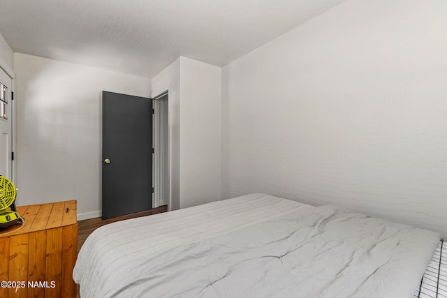 5552 White Tail Ln, Flagstaff, AZ 86005 - bedroom with baseboards and wood finished floors