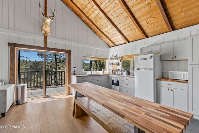 5552 White Tail Ln, Flagstaff, AZ 86005 - kitchen with white appliances, wood ceiling, a sink, and light wood-style flooring