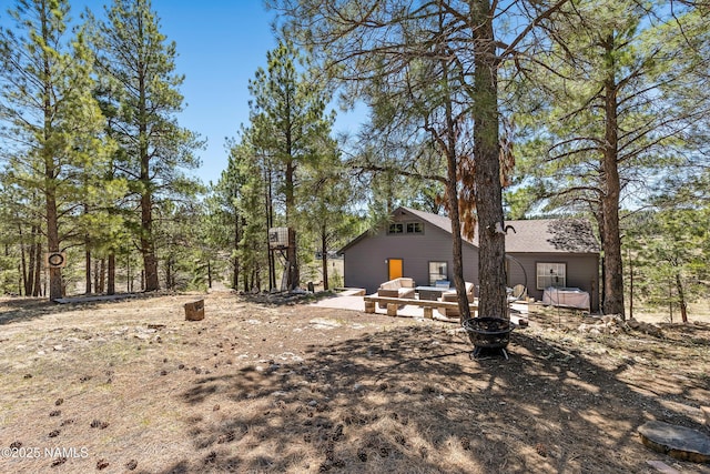 5552 White Tail Ln, Flagstaff, AZ 86005 - view of yard featuring an outdoor structure and a fire pit