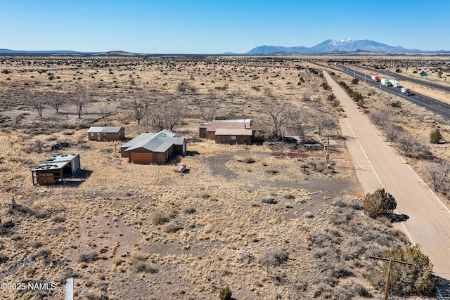 aerial view featuring view of desert, a rural view, and a mountain view