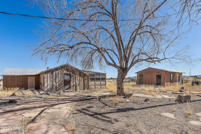 exterior space featuring a pole building and an outdoor structure