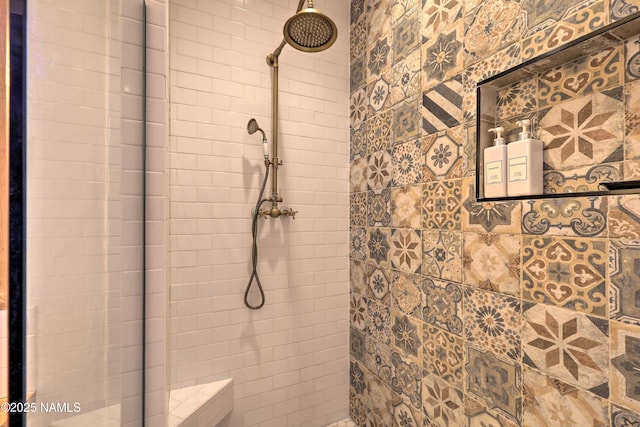 bathroom with tiled shower