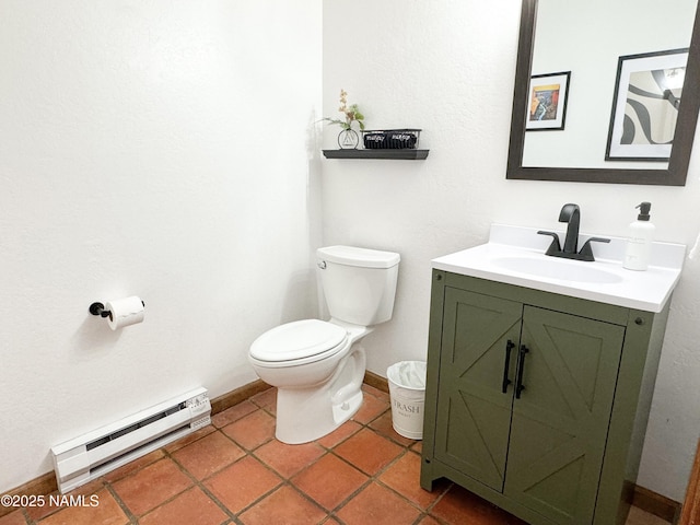 bathroom featuring vanity, tile patterned floors, toilet, and baseboard heating