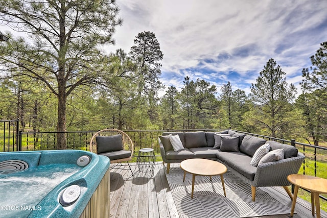 deck featuring grilling area, outdoor lounge area, and a hot tub