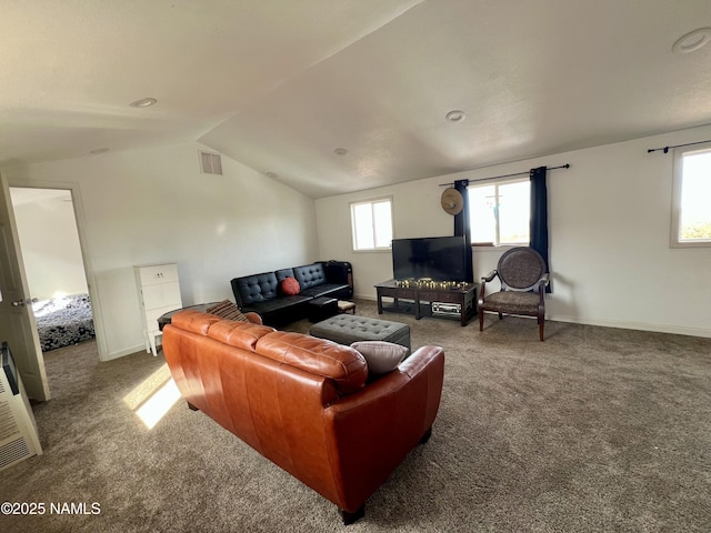 living room featuring vaulted ceiling, carpet floors, visible vents, and baseboards