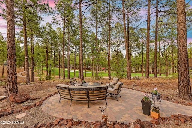 3480 W Lead Rope, Flagstaff, AZ 86005 - view of patio featuring view of scattered trees and an outdoor fire pit