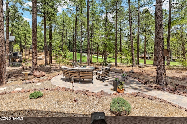 3480 W Lead Rope, Flagstaff, AZ 86005 - view of patio / terrace with view of wooded area and outdoor lounge area