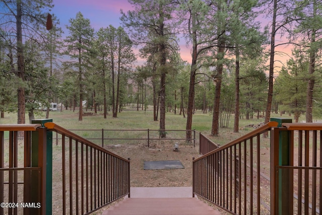 deck at dusk with fence