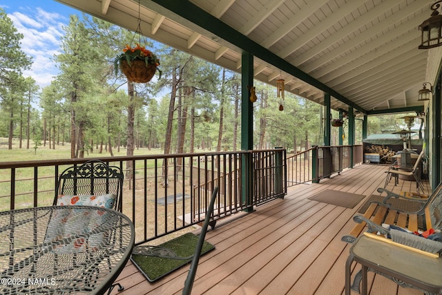 wooden terrace with outdoor dining space