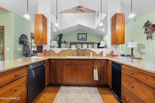 kitchen featuring a sink, light stone counters, light wood-style floors, brown cabinetry, and dishwashing machine