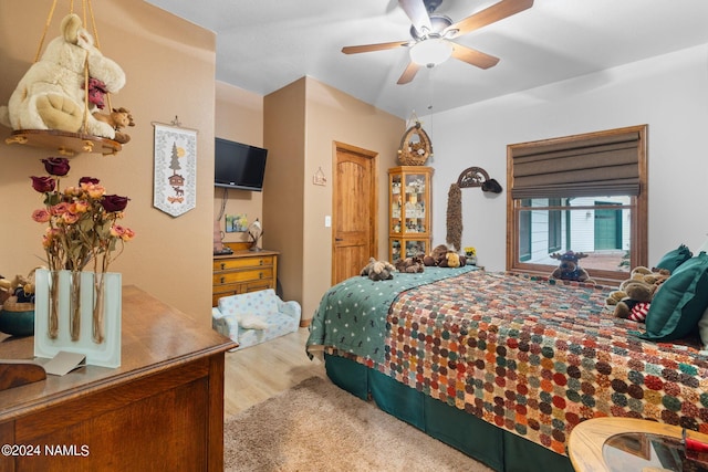 bedroom with ceiling fan and wood finished floors