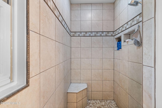 bathroom featuring tiled shower