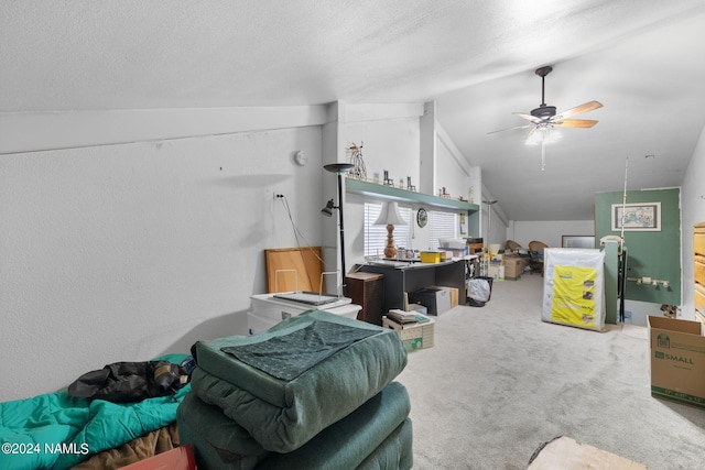 living area featuring ceiling fan, a textured ceiling, lofted ceiling, and carpet floors