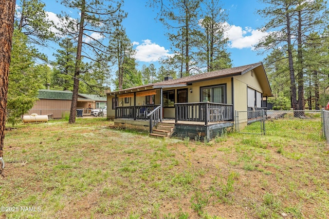 840 E Caribou Rd, Munds Park, AZ 86017 - view of front of home with a deck and a gate