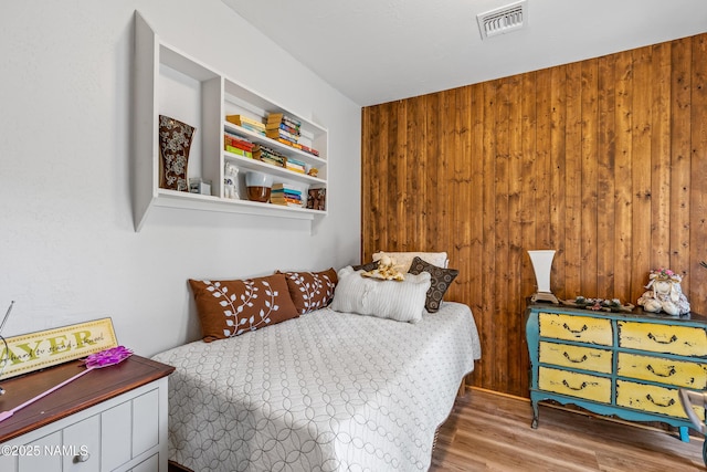 840 E Caribou Rd, Munds Park, AZ 86017 - bedroom with wood finished floors and wooden walls