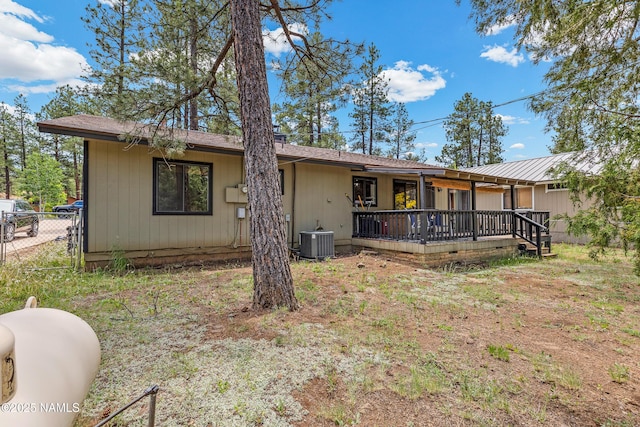 840 E Caribou Rd, Munds Park, AZ 86017 - back of property featuring central AC and a wooden deck