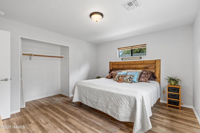 840 E Caribou Rd, Munds Park, AZ 86017 - bedroom with wood finished floors, baseboards, and a closet