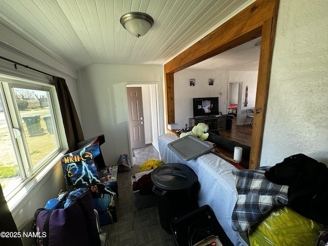 interior space with lofted ceiling and wooden ceiling