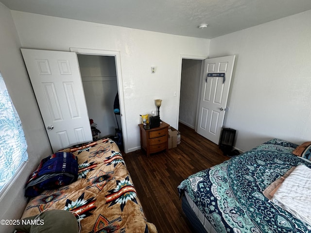 bedroom with a closet and wood finished floors