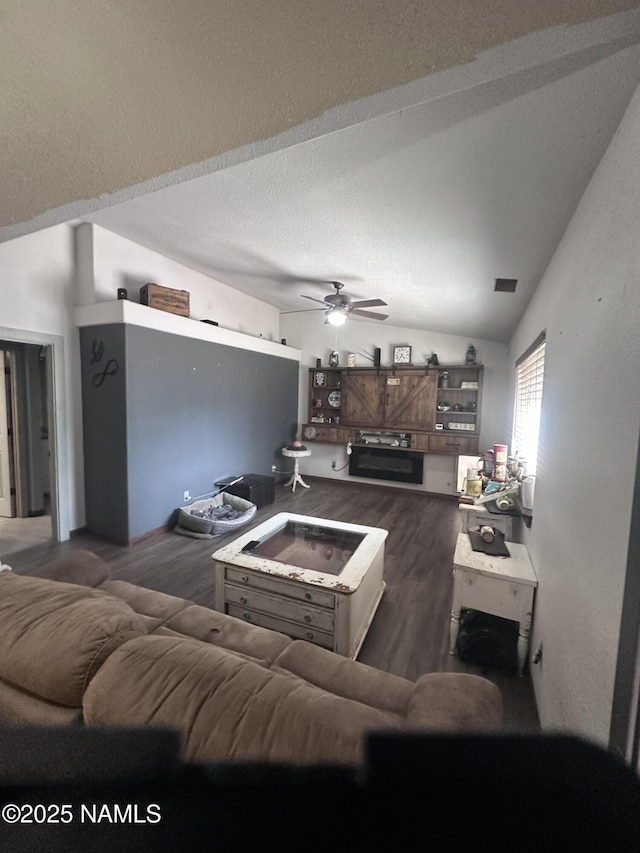 255 S Beech Dr, Flagstaff, AZ 86004 - living room featuring a ceiling fan, wood finished floors, and vaulted ceiling
