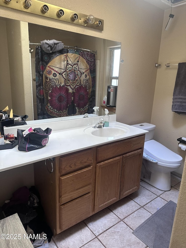 255 S Beech Dr, Flagstaff, AZ 86004 - full bath featuring tile patterned floors, vanity, a shower with shower curtain, and toilet