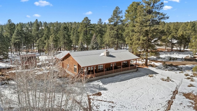 exterior space featuring a view of trees