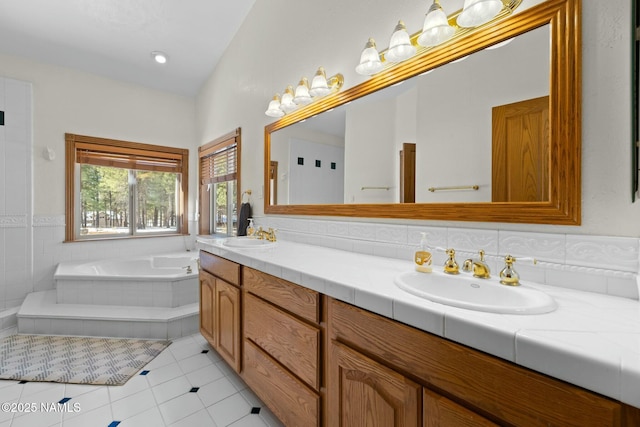 full bath with a sink, a bath, double vanity, and tile patterned flooring