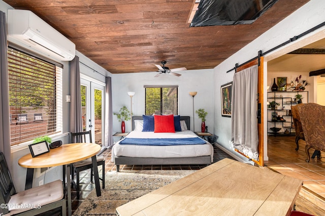 1125 Trails End Dr, Sedona, AZ 86336 - bedroom featuring wood ceiling, a wall mounted air conditioner, multiple windows, access to exterior, and a barn door