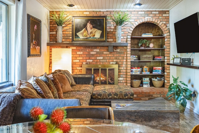 1125 Trails End Dr, Sedona, AZ 86336 - living area with wood finished floors, wooden ceiling, and a fireplace