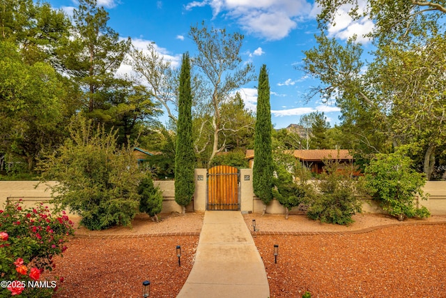 1125 Trails End Dr, Sedona, AZ 86336 - view of front of property featuring a gate and stucco siding