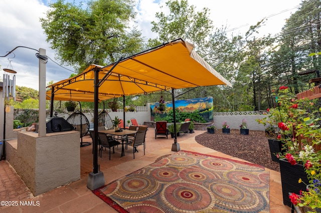 1125 Trails End Dr, Sedona, AZ 86336 - fenced backyard featuring a patio, outdoor dining space, a gazebo, and area for grilling