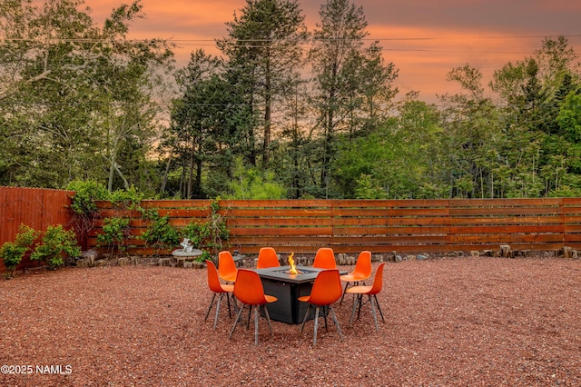 1125 Trails End Dr, Sedona, AZ 86336 - fenced backyard featuring a fire pit and view of scattered trees